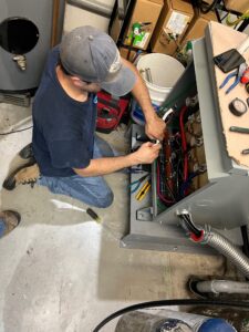 Electrician fixing electrical problem in basement